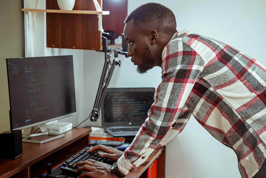 A man working at a computer workstation